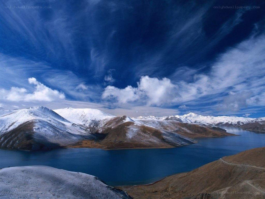 snow-capped mountains and blue lake