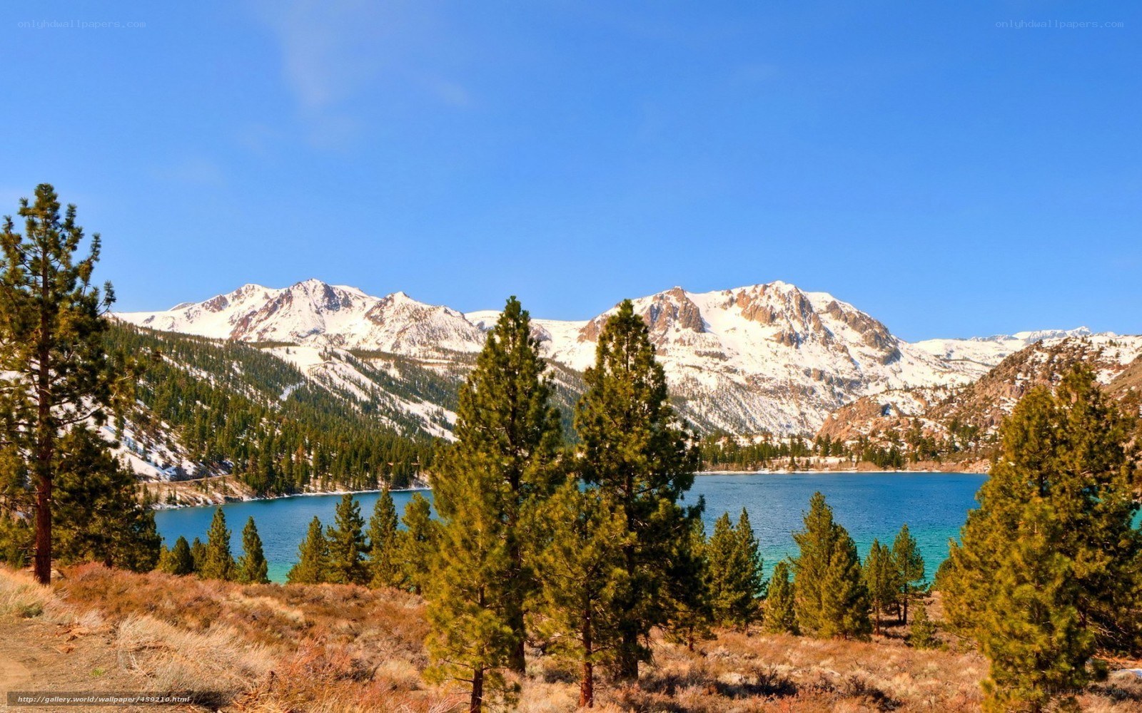 Snow-capped mountains and blue lake