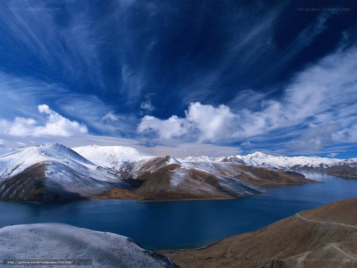 Snow-capped mountains and blue lake