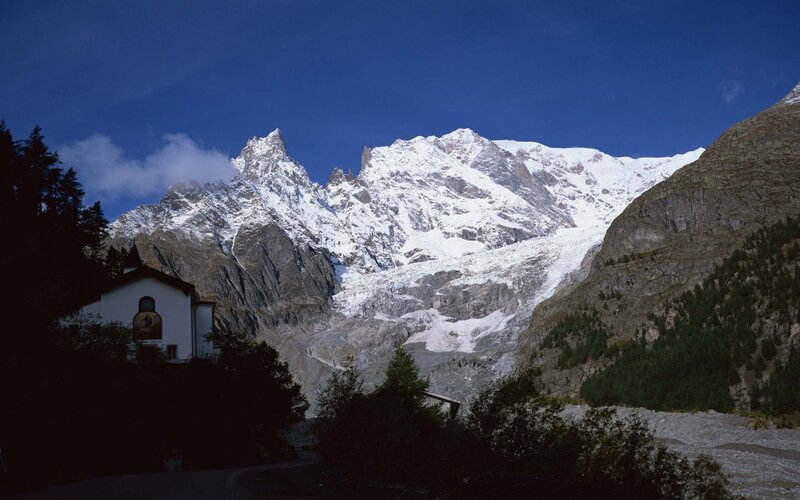 Snow-capped mountains and chapel
