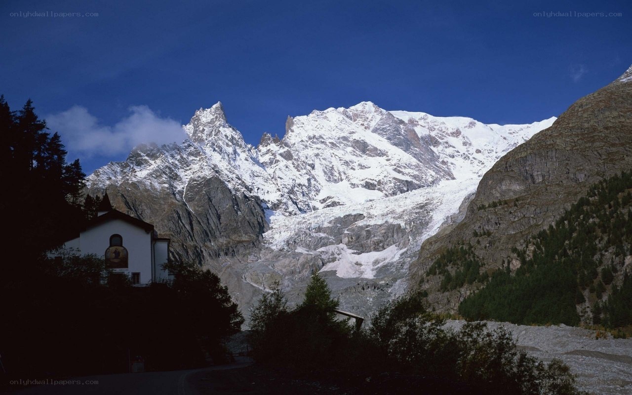 Snow-capped mountains and chapel