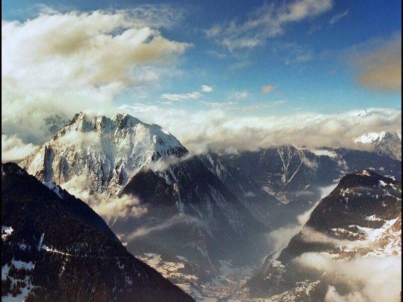 snow-capped mountains and clouds