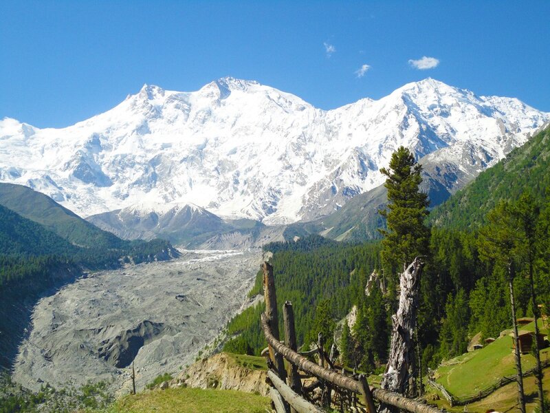 snow-capped mountains and forest valley