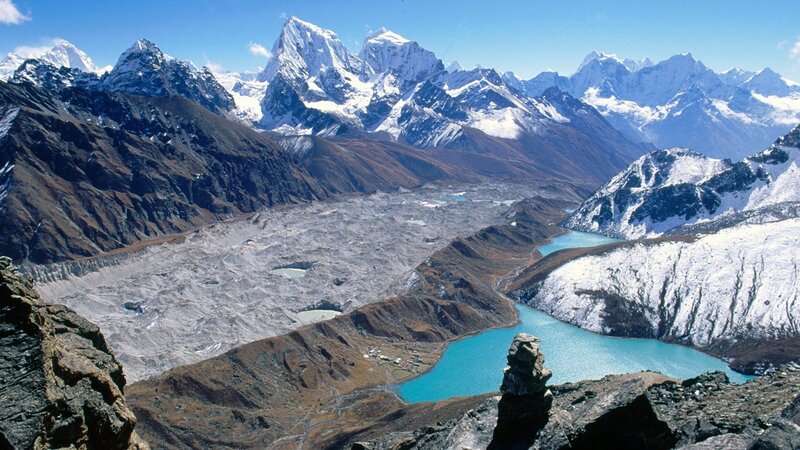 snow-capped mountains and glacial lake