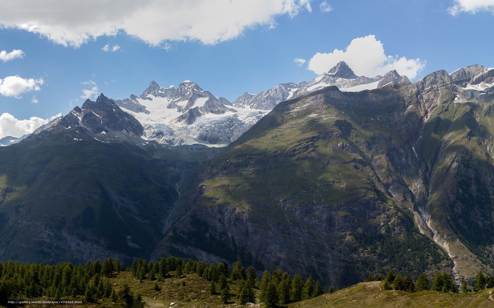 snow-capped mountains and green slopes