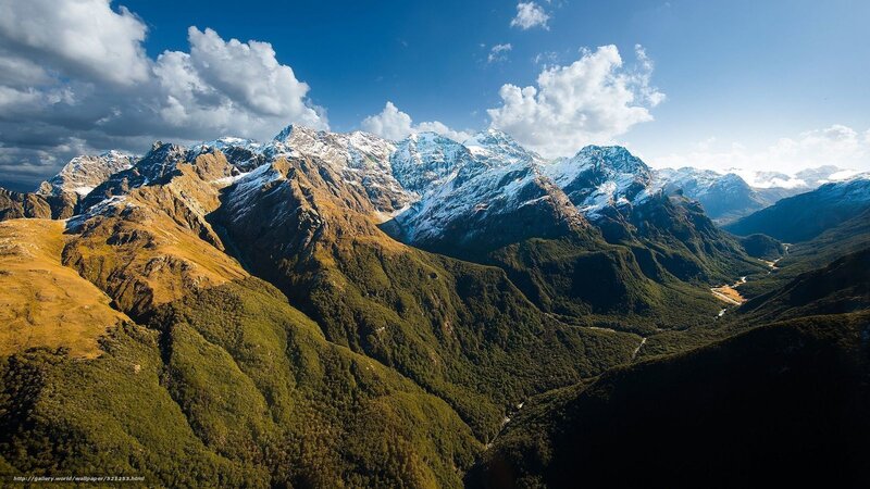 Snow-capped mountains and green valleys