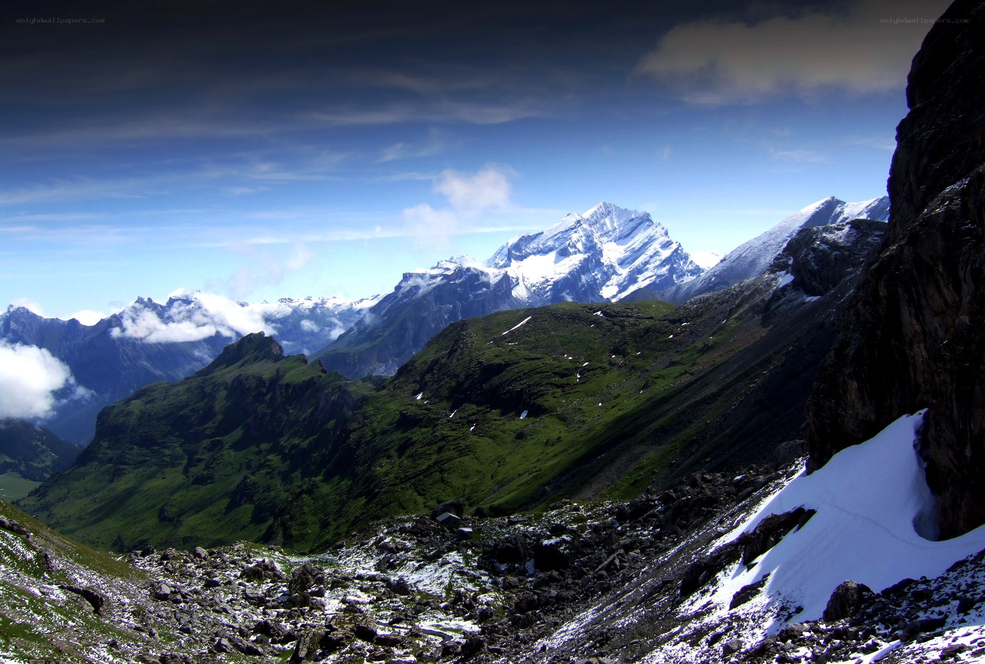 Snow-capped mountains and green valleys