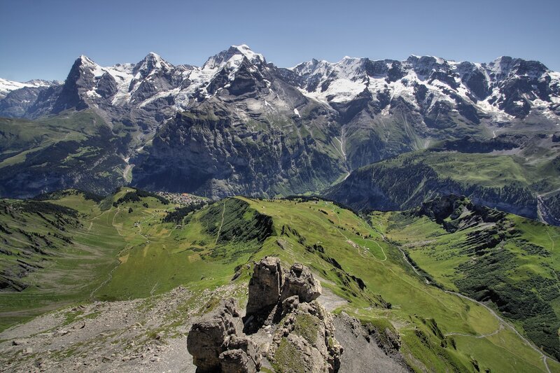 Snow-capped mountains and green valleys