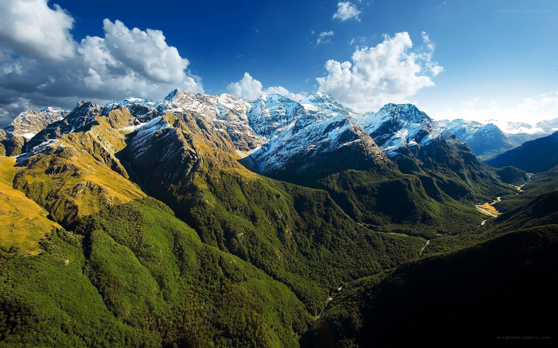 snow-capped mountains and green valleys