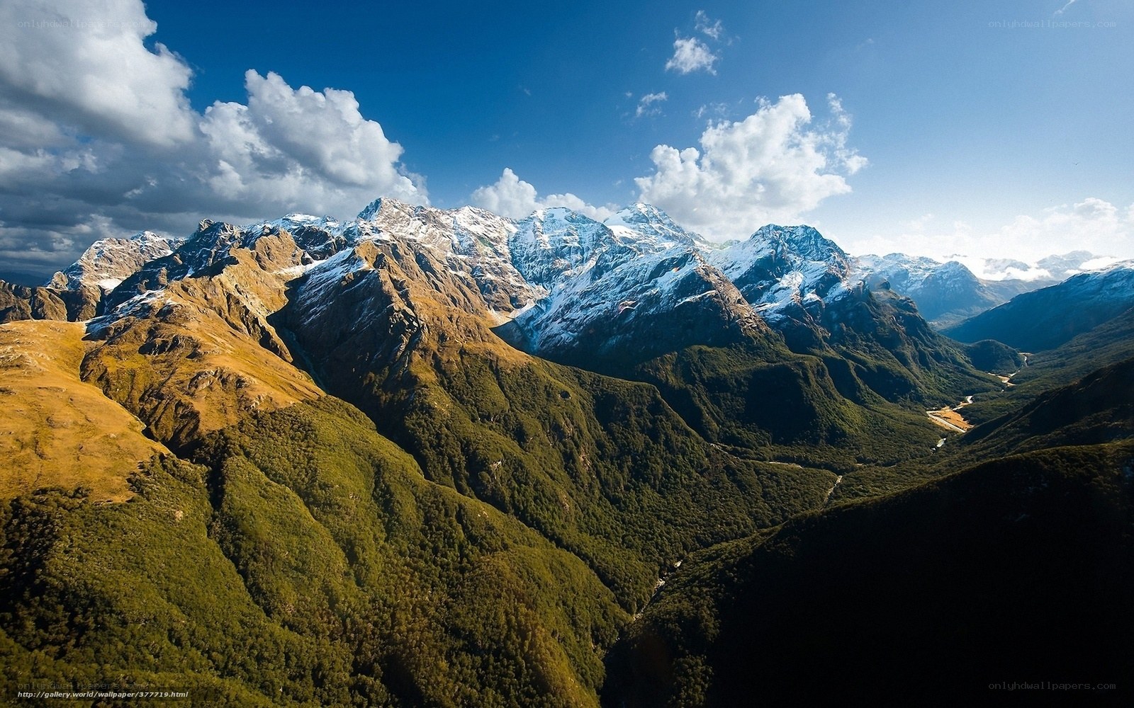snow-capped mountains and green valleys