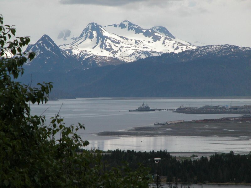 snow-capped mountains and harbor