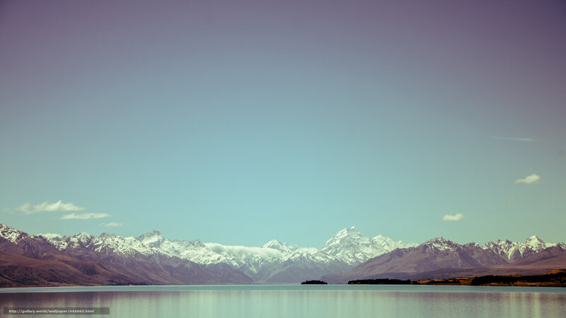 Snow-capped mountains and lake