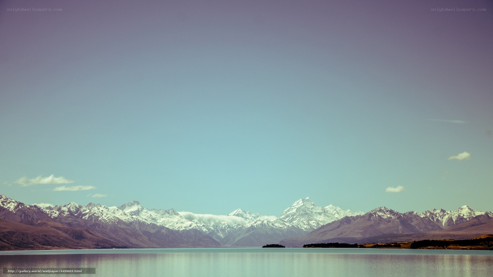 Snow-capped mountains and lake