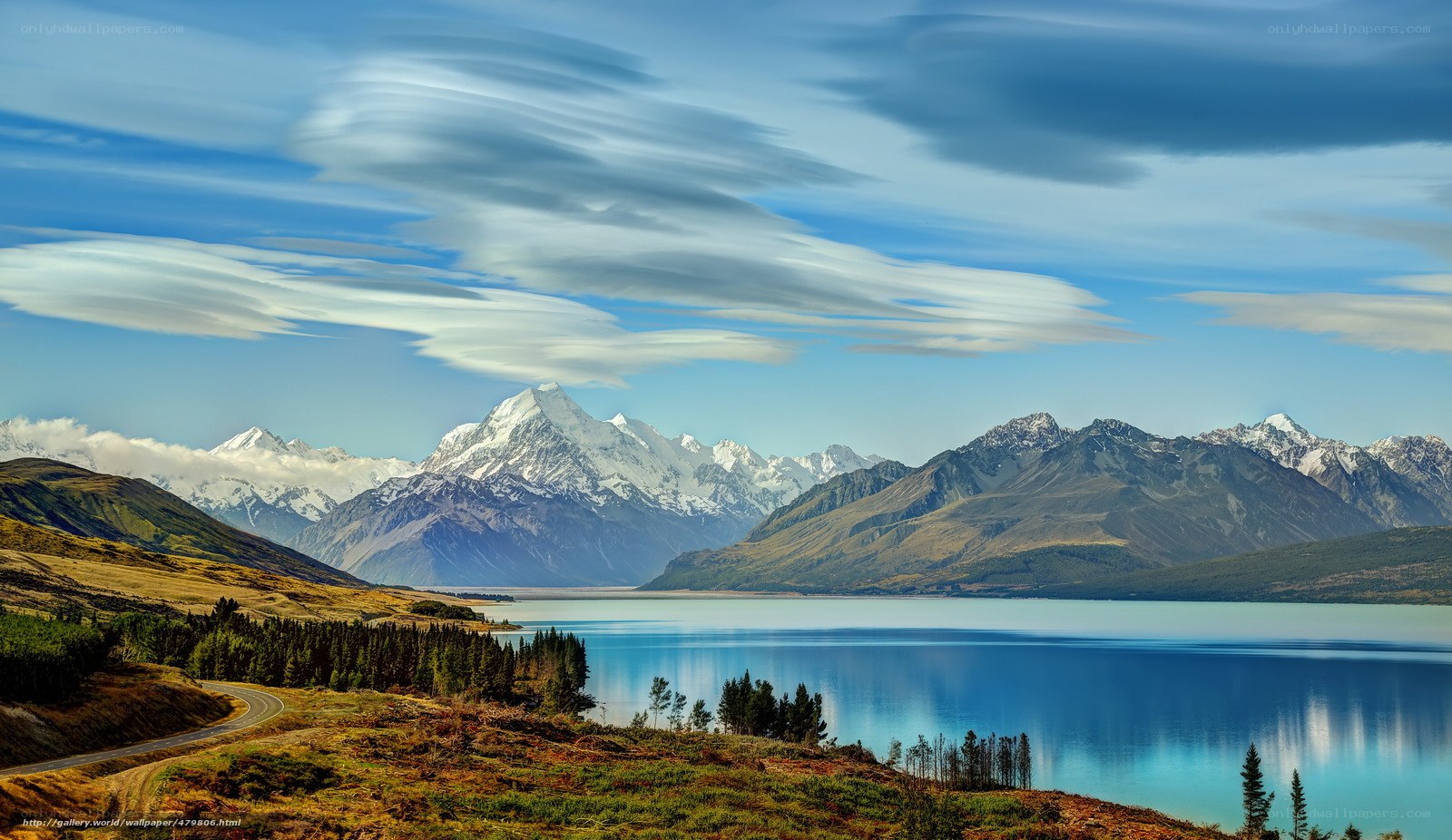 Snow-capped mountains and lake