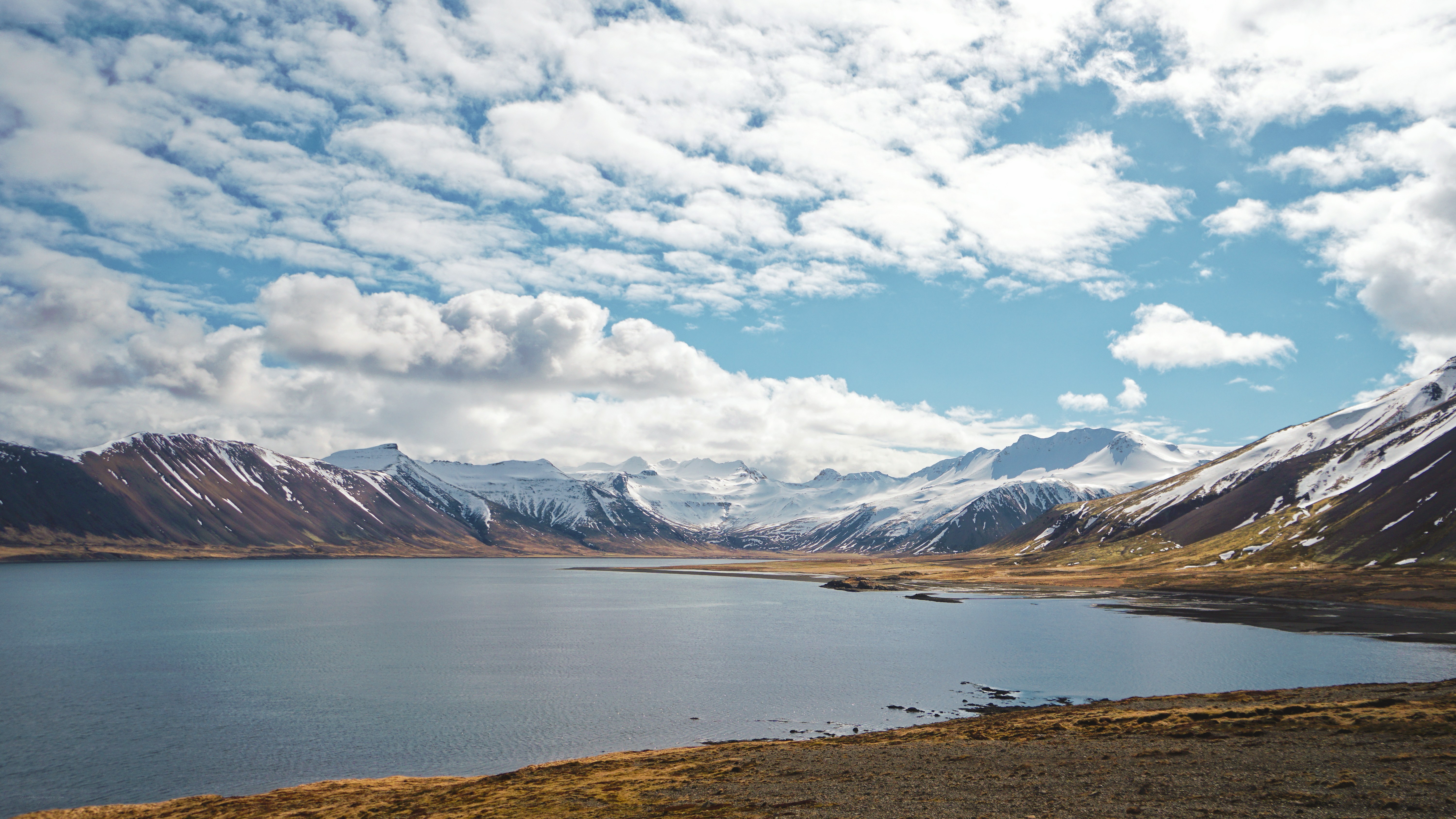 Snow-capped mountains and lake