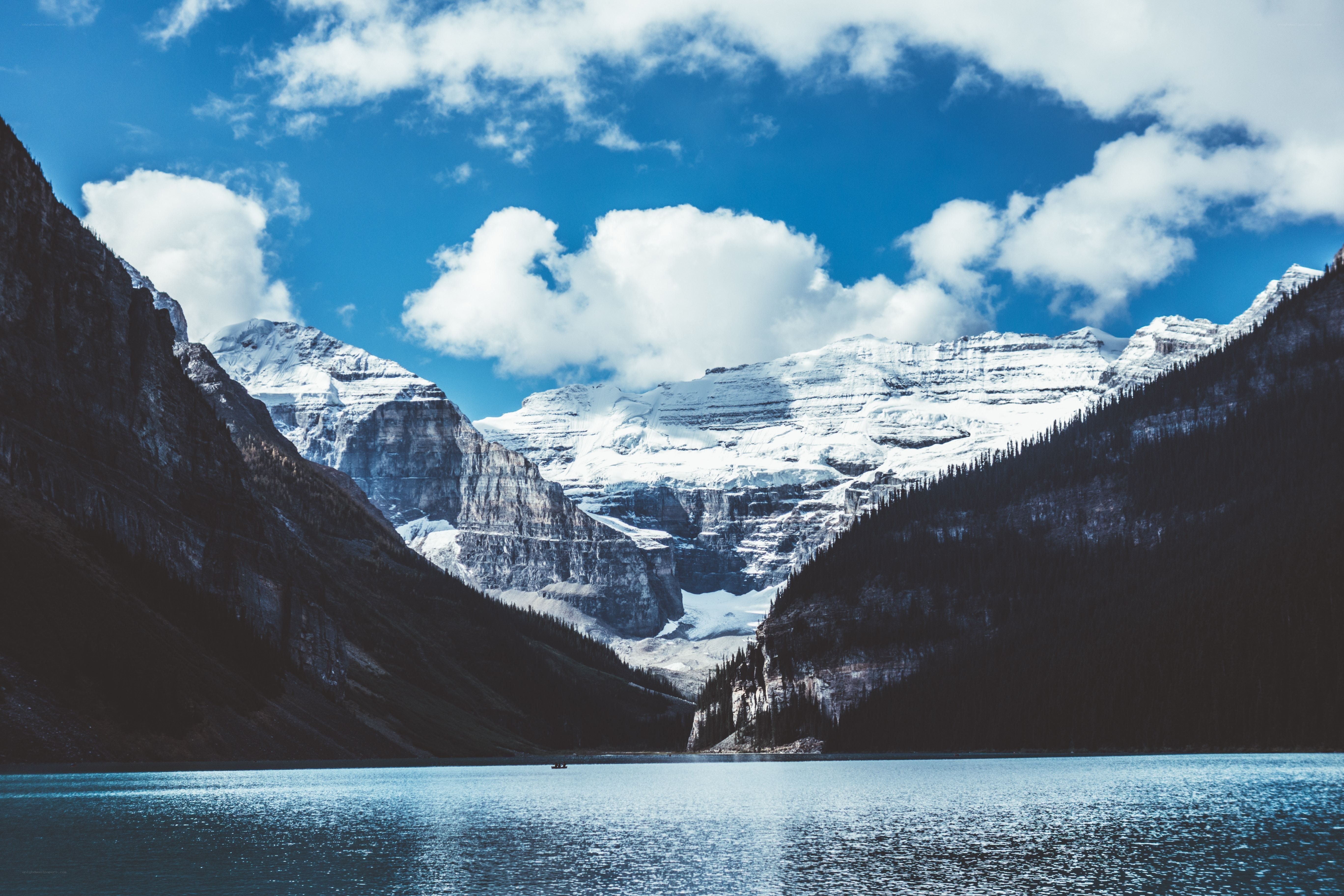 Snow-capped mountains and lake