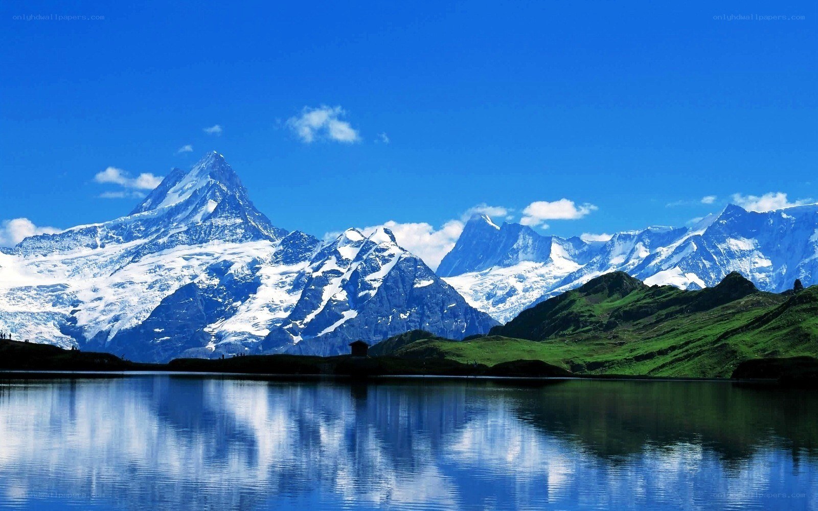 Snow-capped mountains and lake