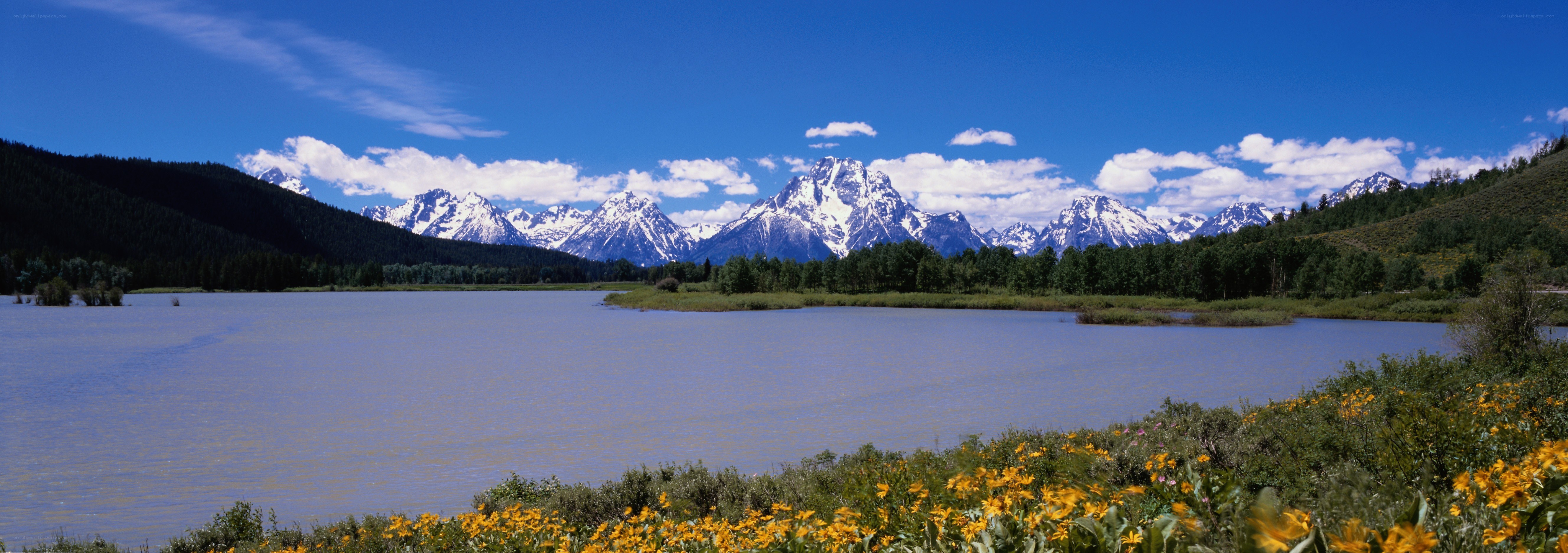 Snow-capped mountains and lake
