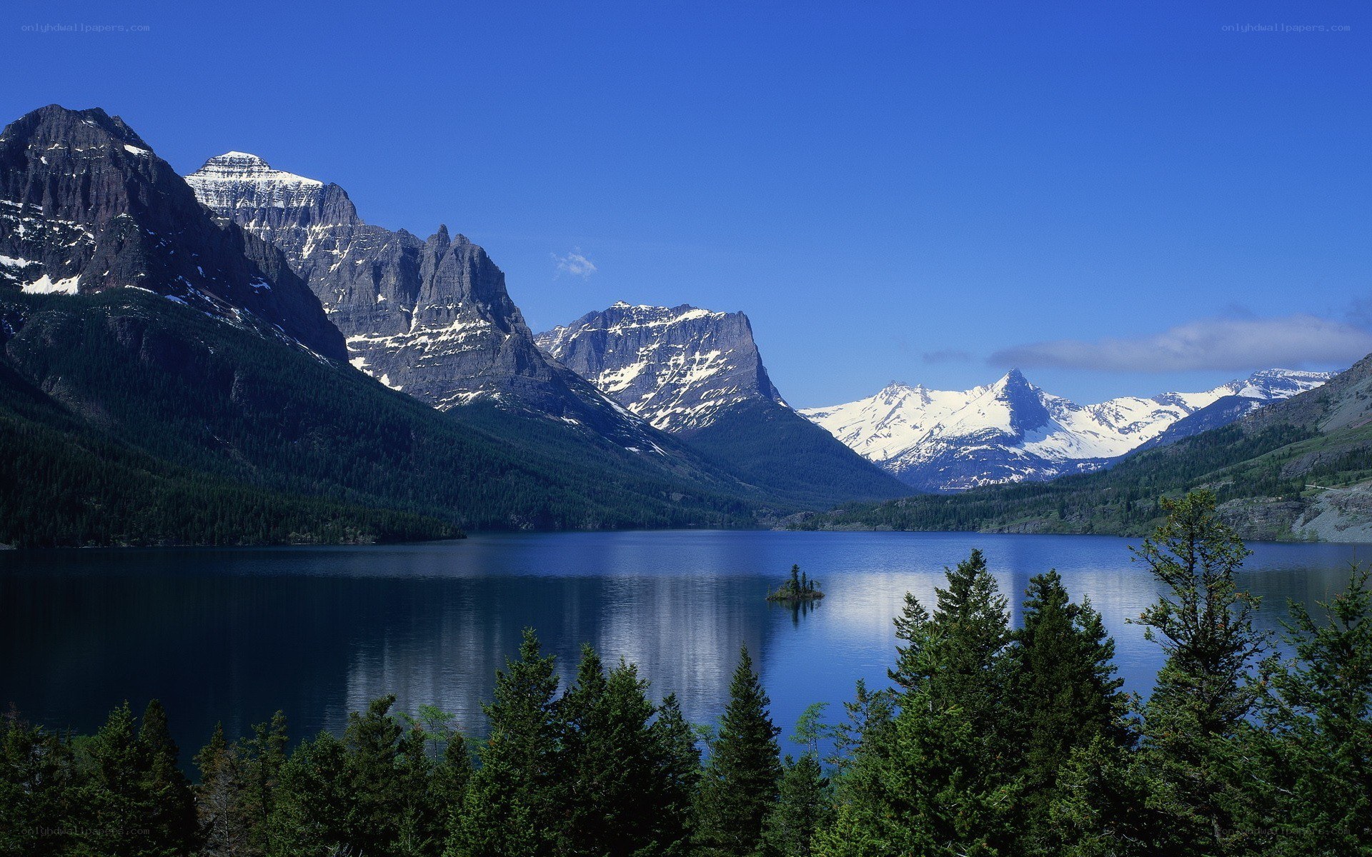 Snow-capped mountains and lake
