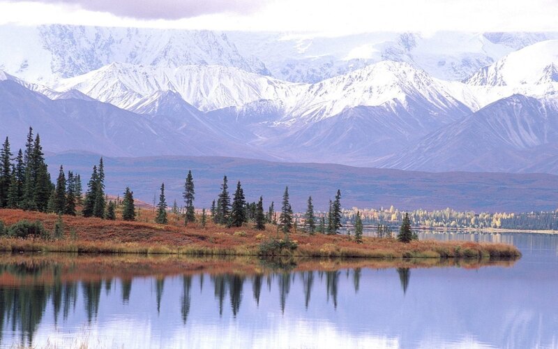 snow-capped mountains and lake
