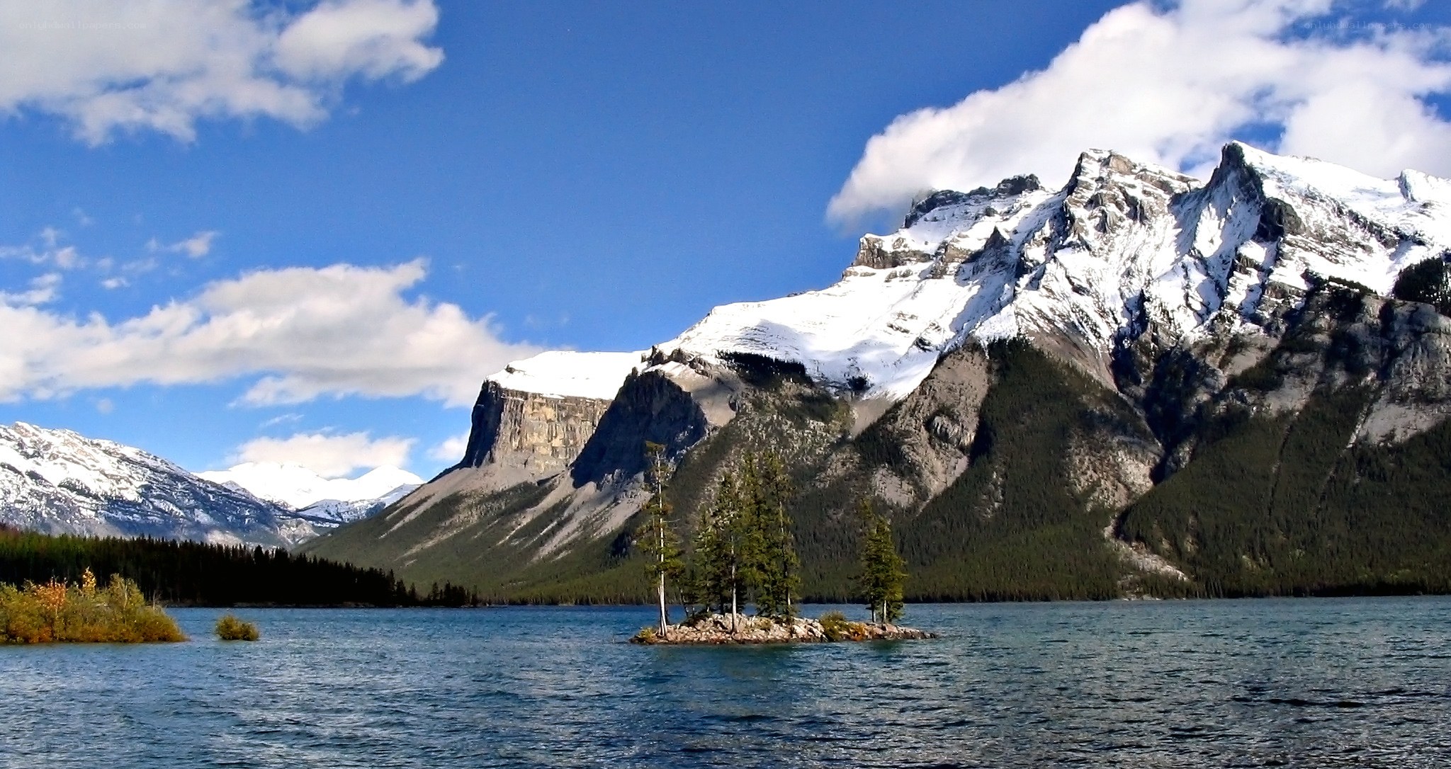 snow-capped mountains and lake