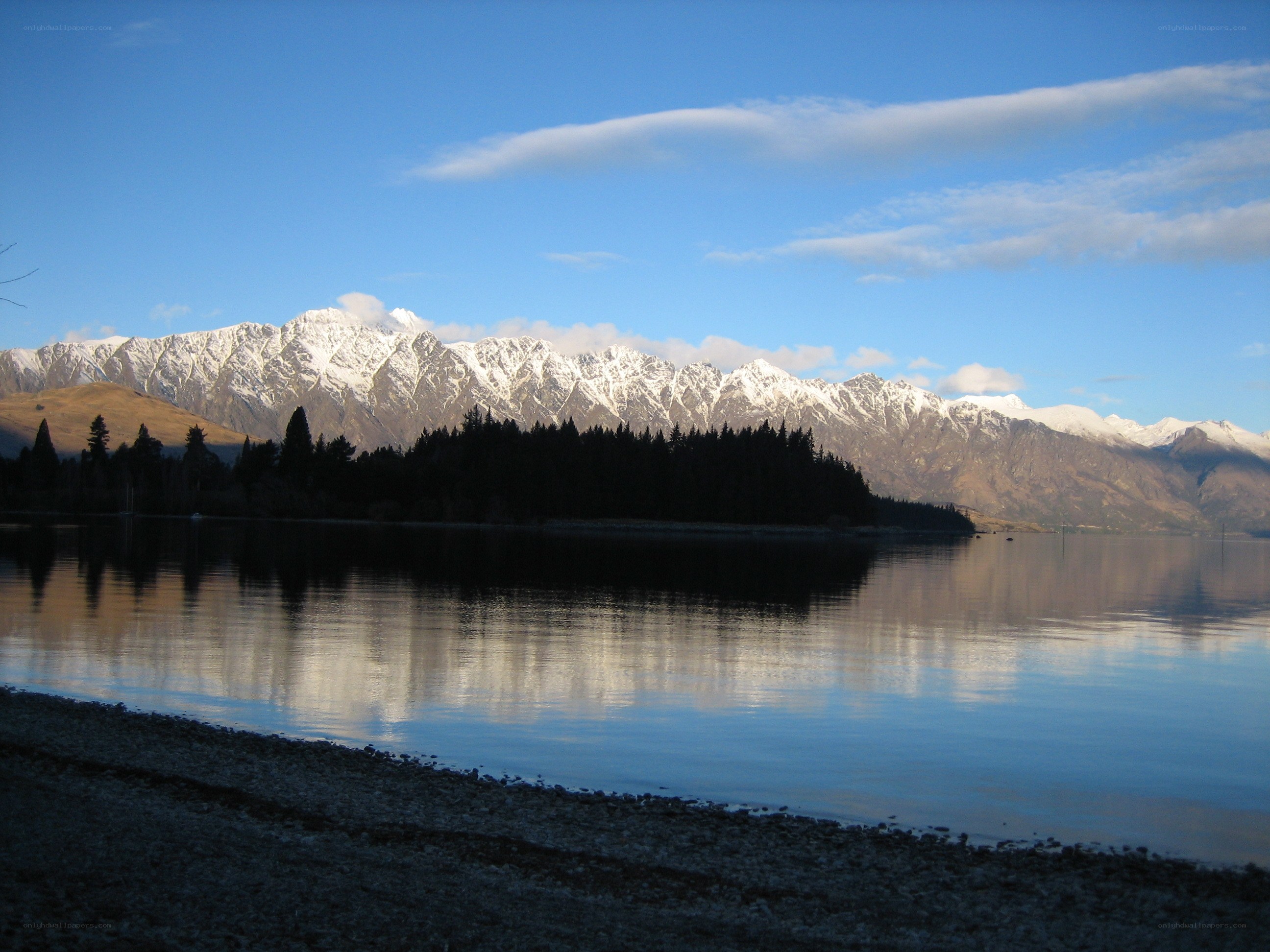 snow-capped mountains and lake