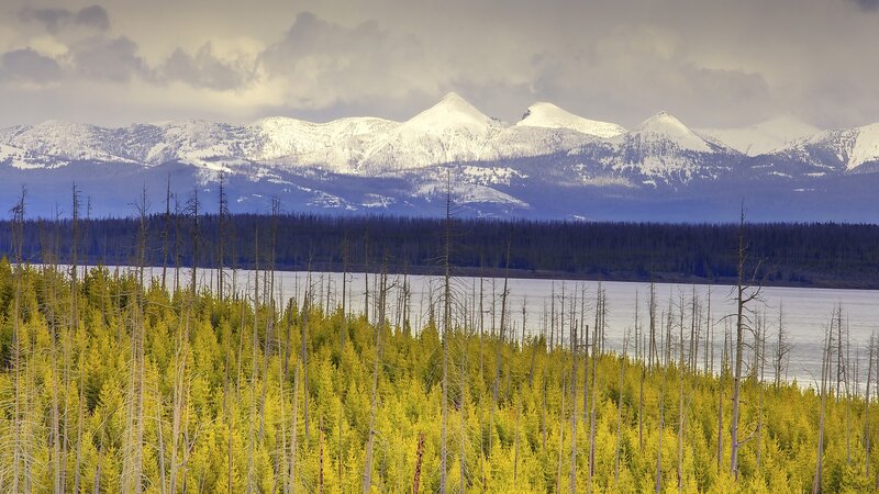 Snow-capped mountains and lake