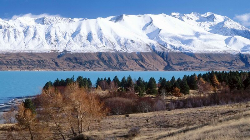 snow-capped mountains and lake