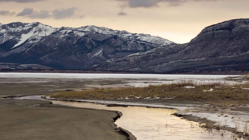 snow-capped mountains and lake