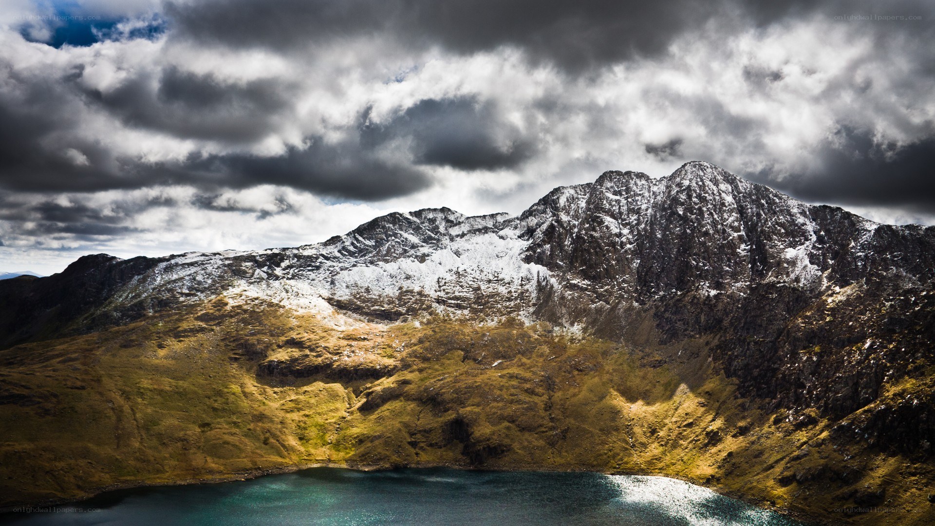 Snow-capped mountains and lake