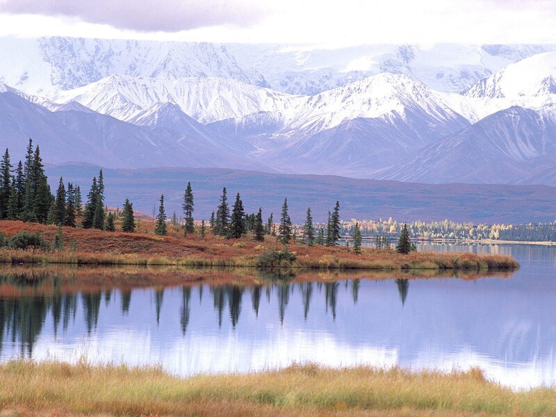 Snow-capped mountains and lake