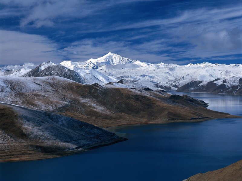 Snow-capped mountains and lake