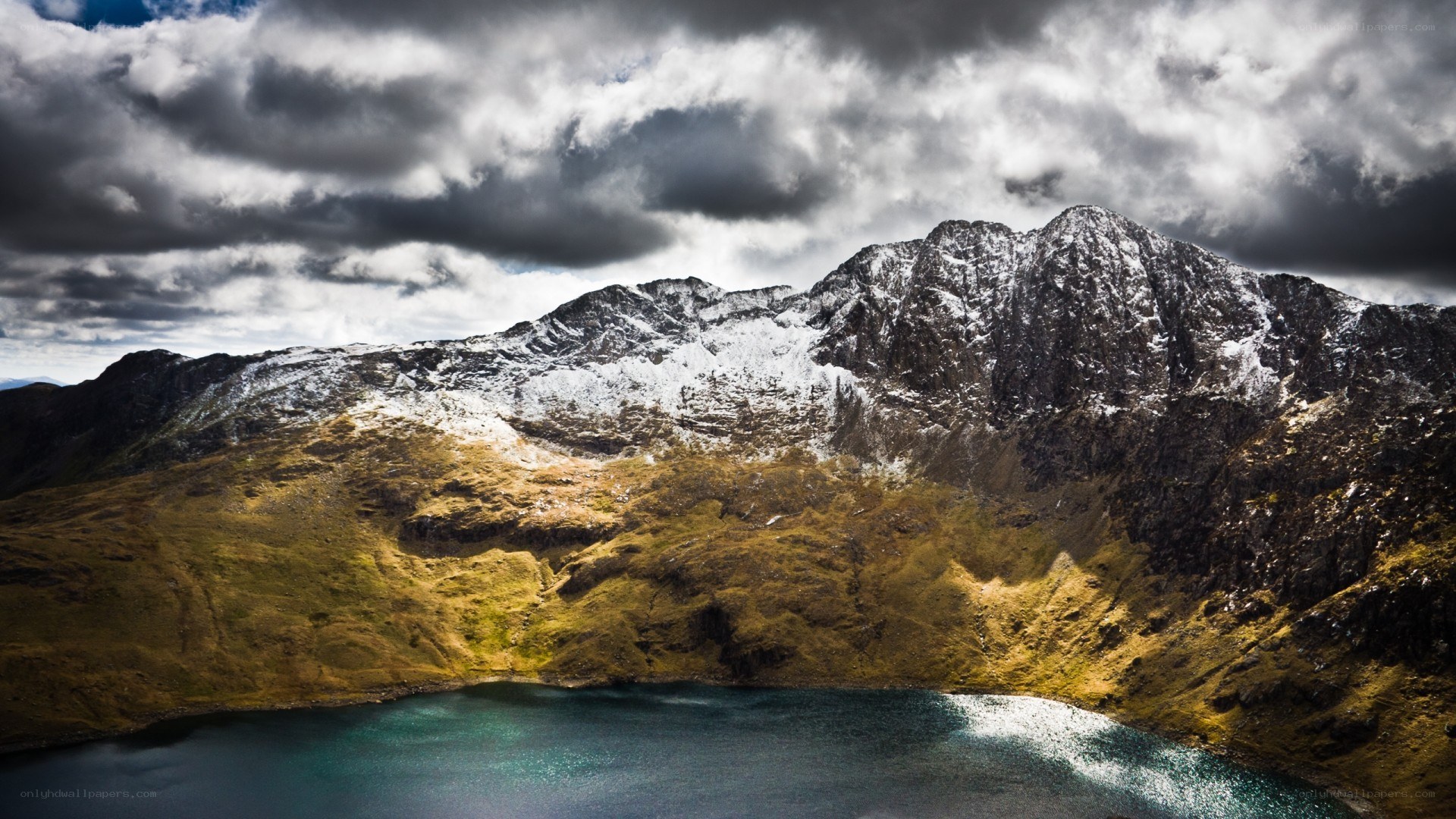 Snow-capped mountains and lake
