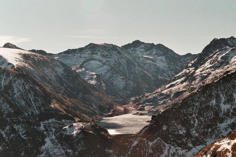 snow-capped mountains and lake