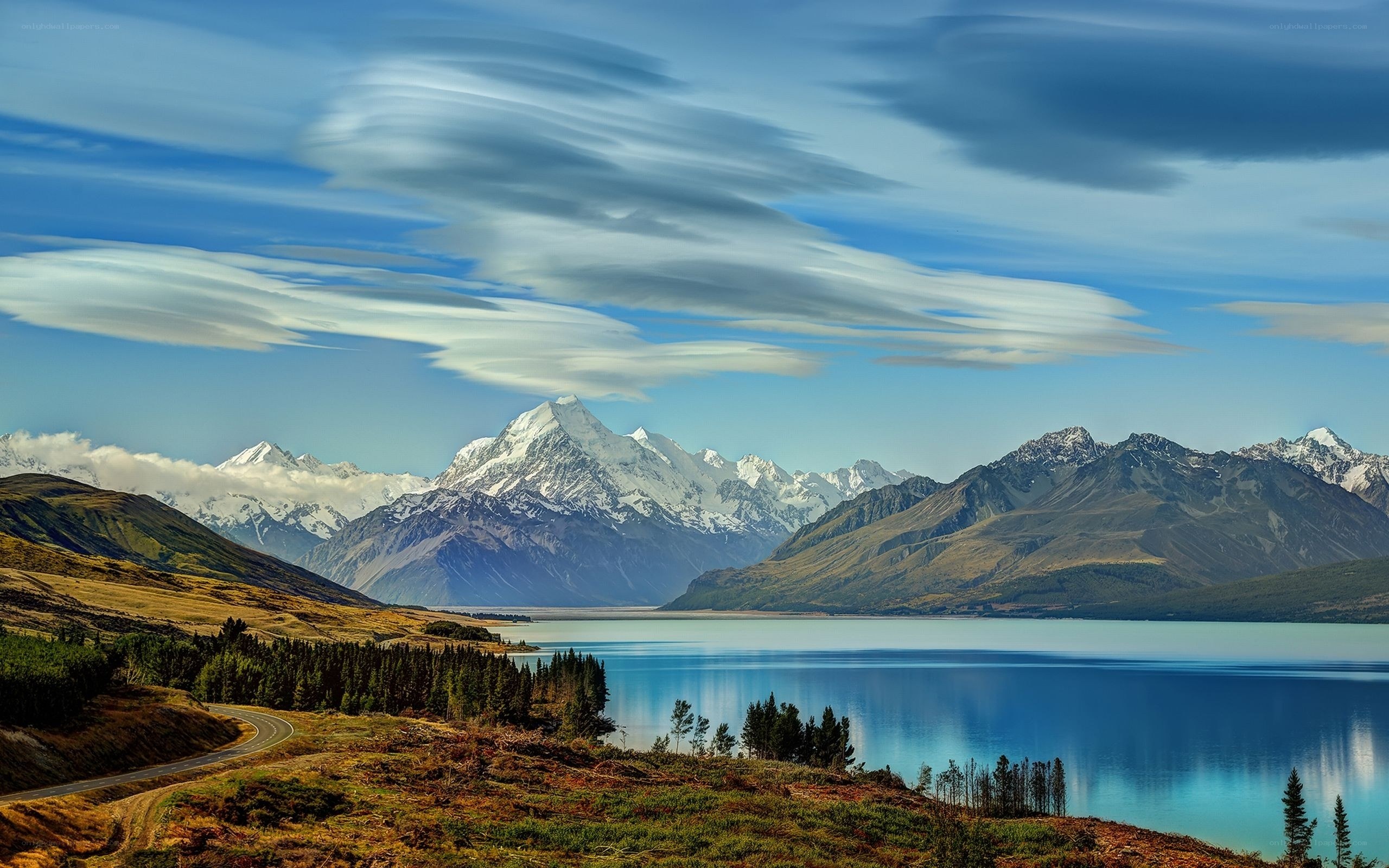 Snow-capped mountains and lake