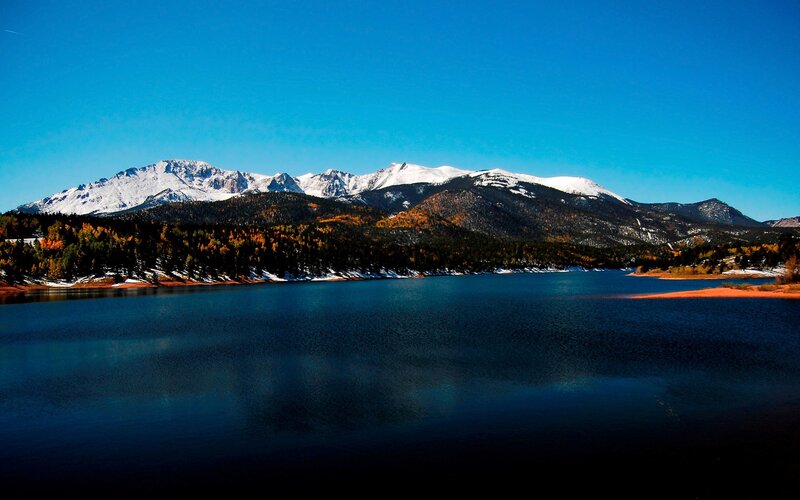 Snow-capped mountains and lake