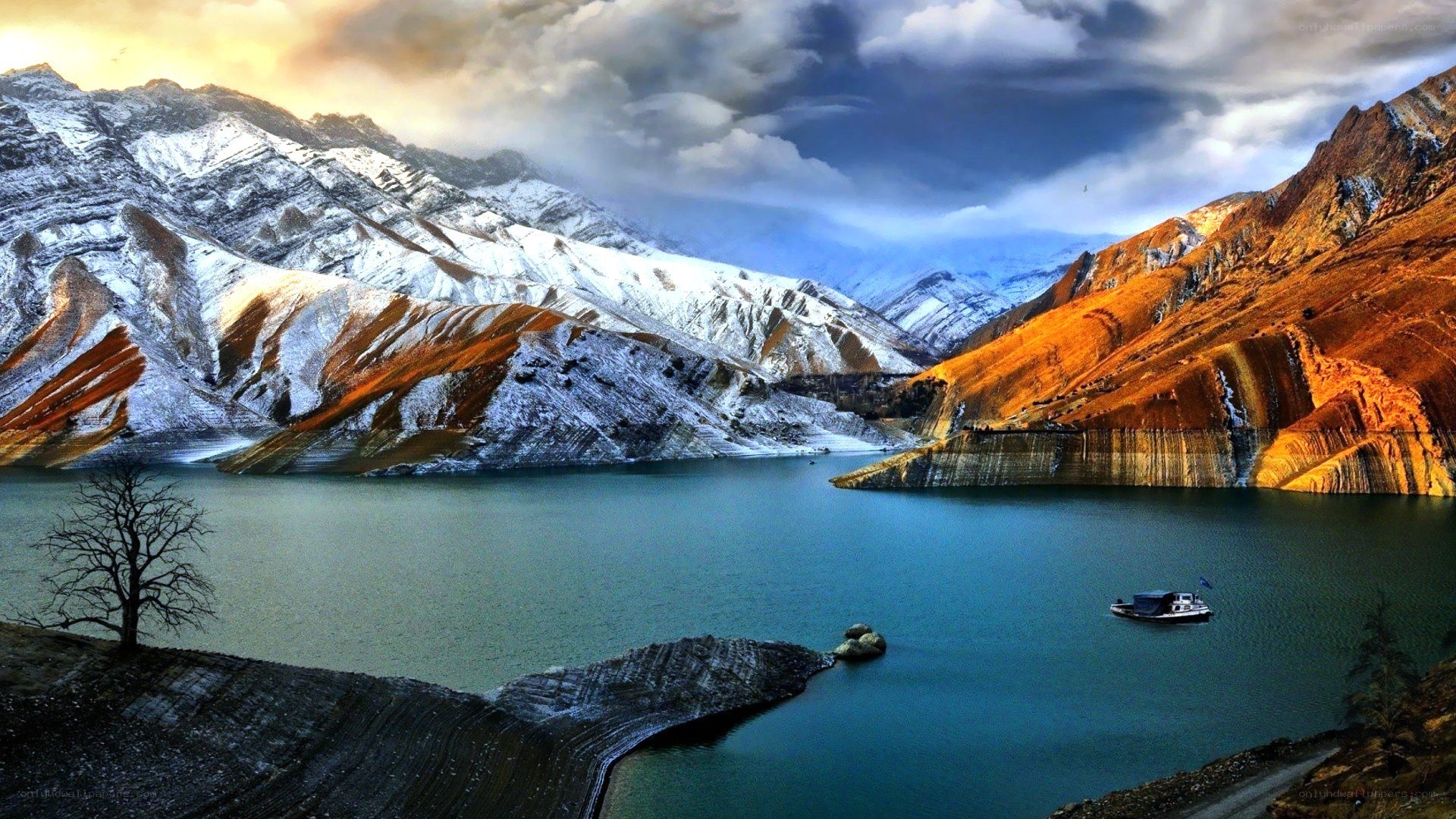 Snow-capped mountains and lake