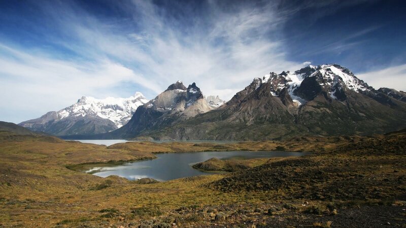 snow-capped mountains and lake