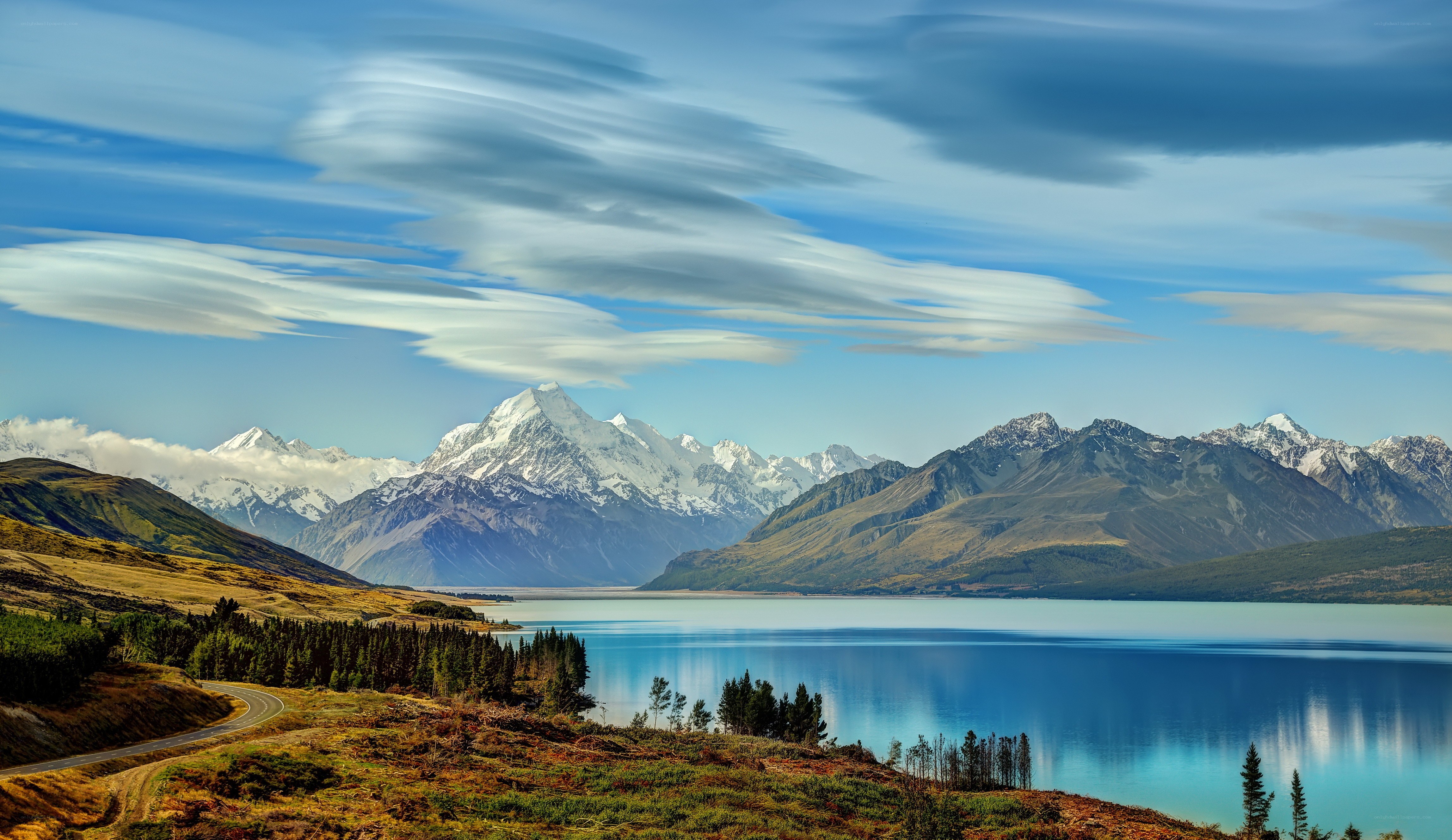 Snow-capped mountains and lake