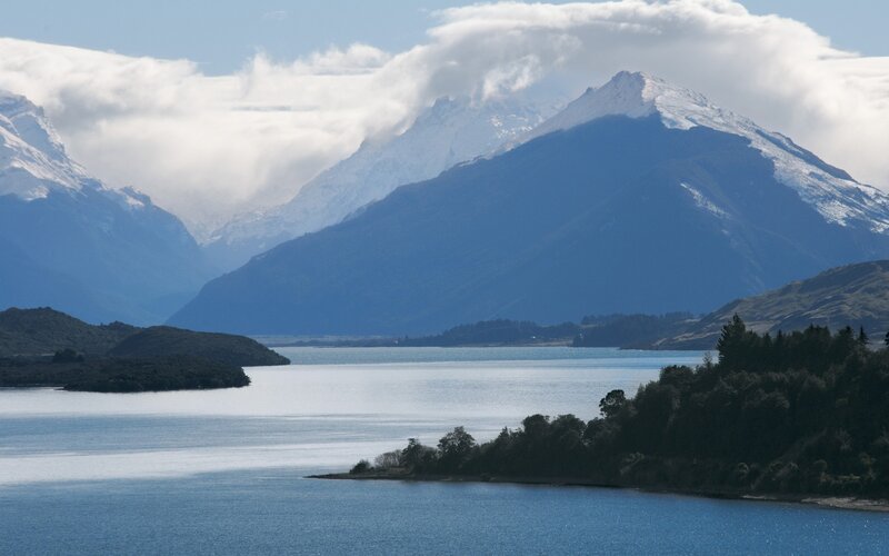 snow-capped mountains and lake