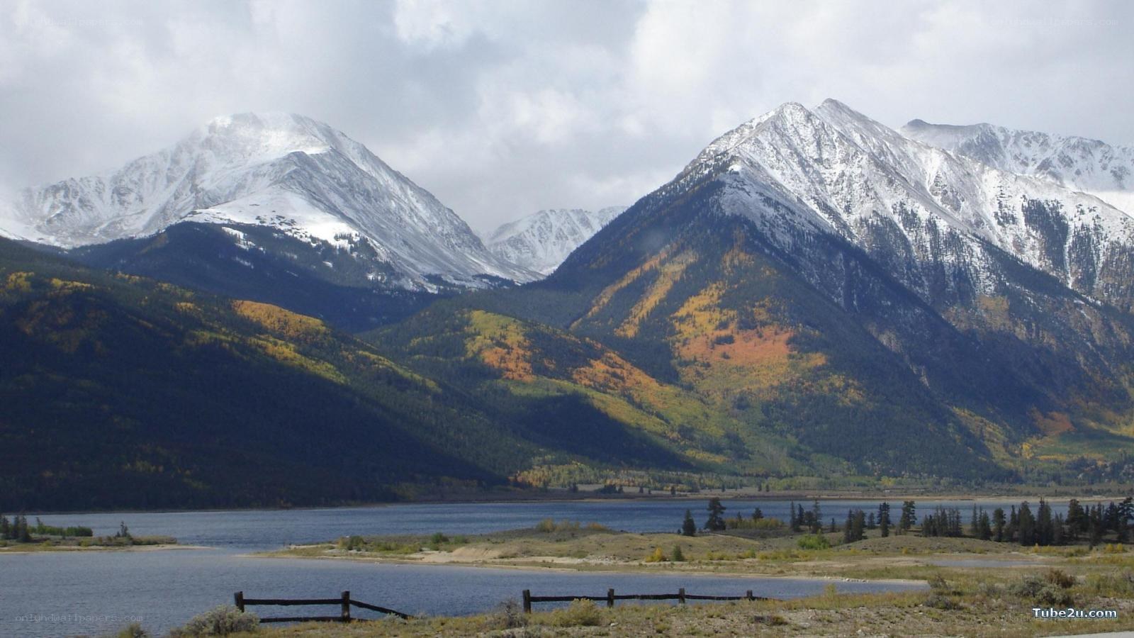 snow-capped mountains and lake