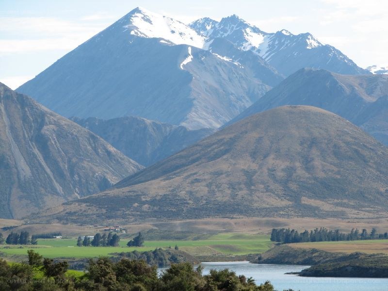 snow-capped mountains and lake
