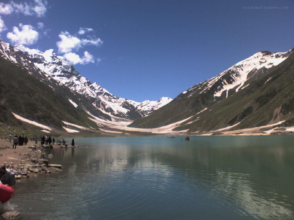 snow-capped mountains and lake