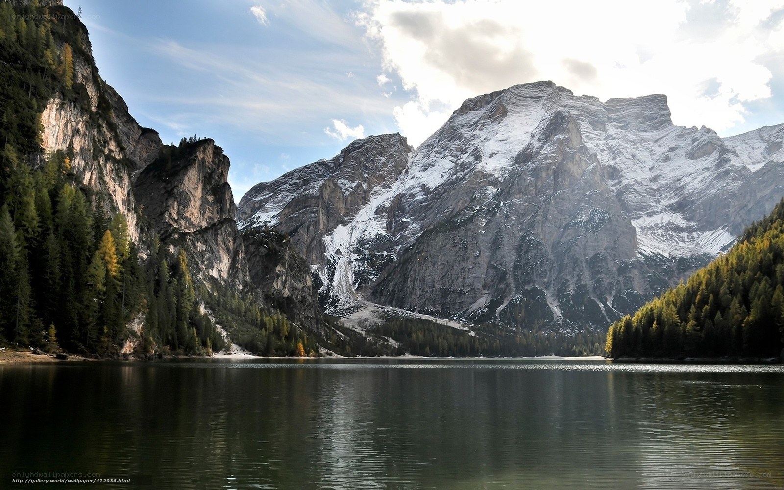 Snow-capped mountains and lake