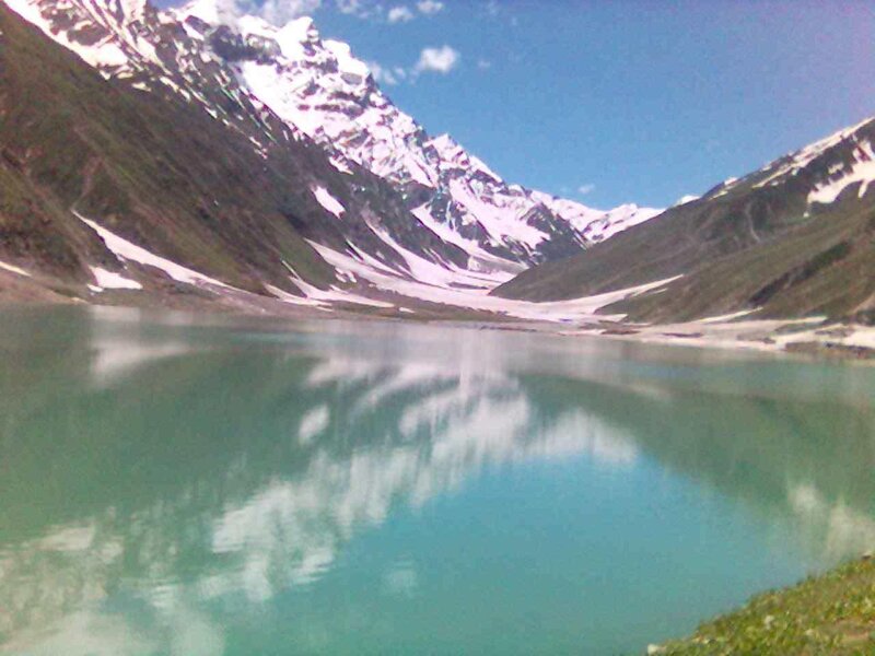 snow-capped mountains and lake