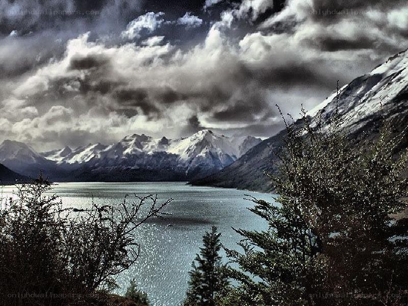 Snow-capped mountains and lake