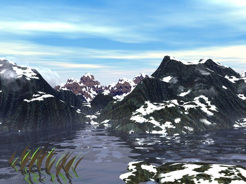 snow-capped mountains and lake