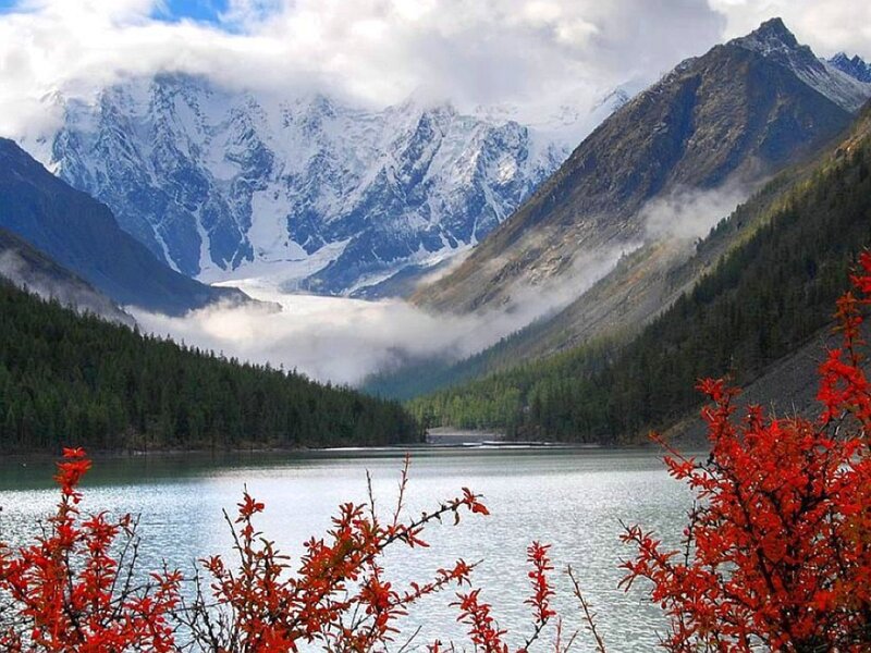 snow-capped mountains and lake