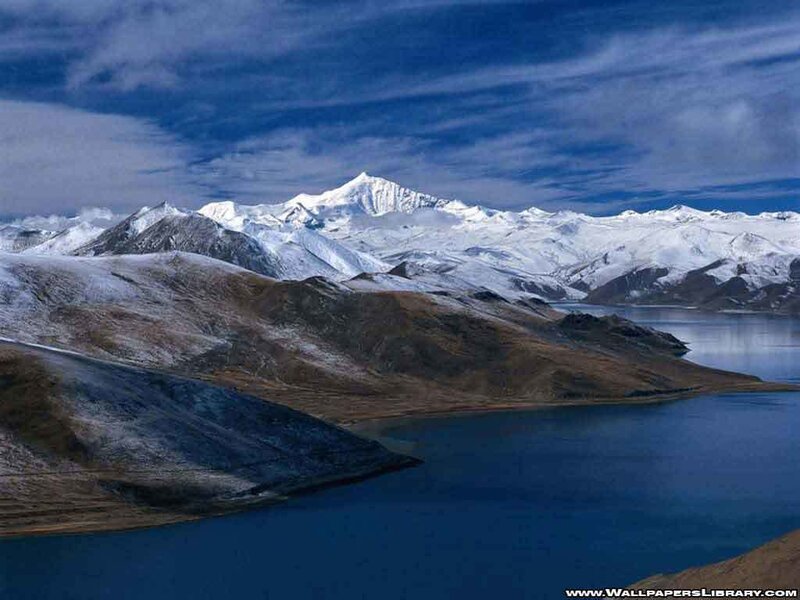 Snow-capped mountains and lake