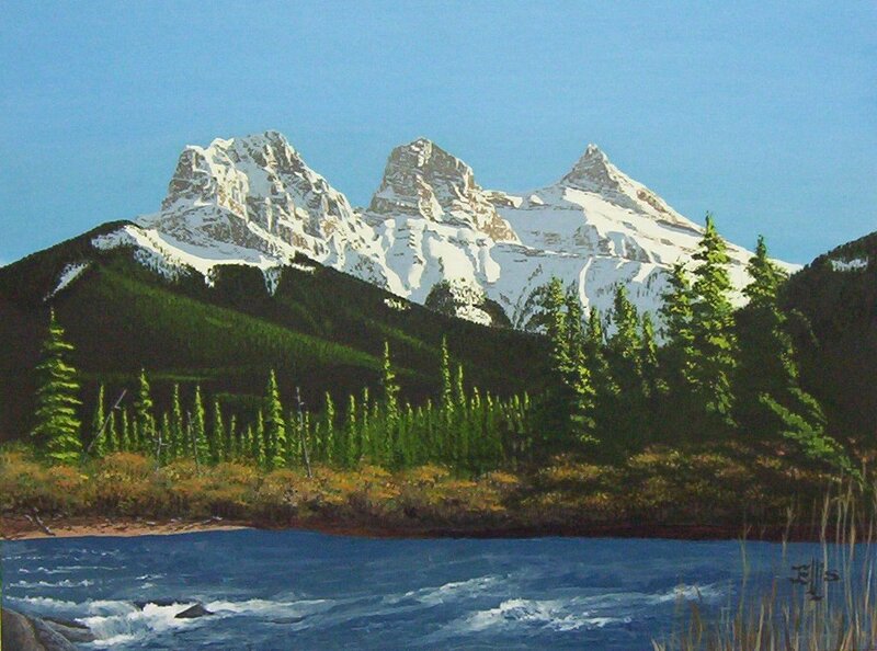 Snow-capped mountains and lake